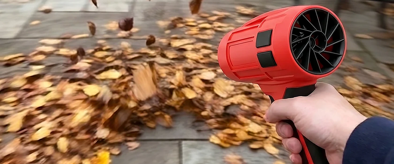 Wood Ranger Leaf Blower clearing autumn leaves from a paved patio — easy for everyday users